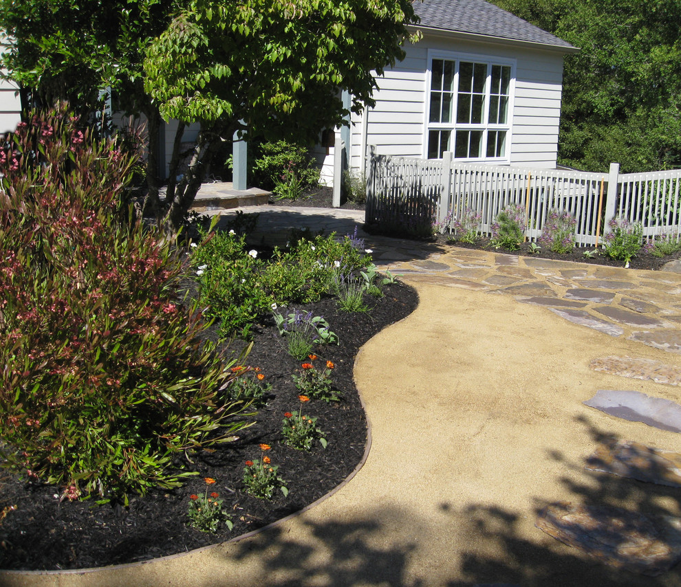 This is an example of a large mediterranean partial sun backyard mulch garden path in San Francisco for summer.