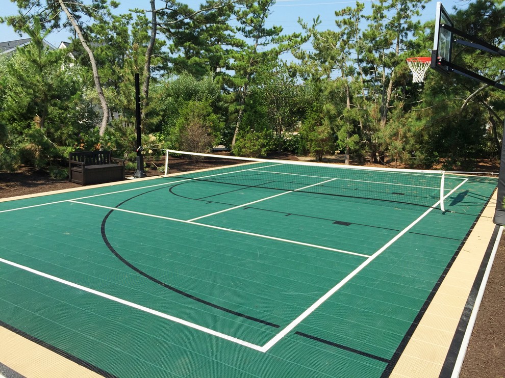 Medium sized modern back partial sun garden in New York with an outdoor sport court and a climbing frame.