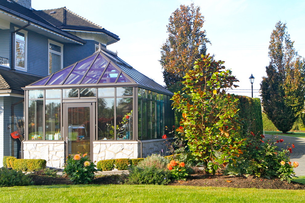 Design ideas for a small contemporary full sun backyard brick formal garden in Vancouver for spring.