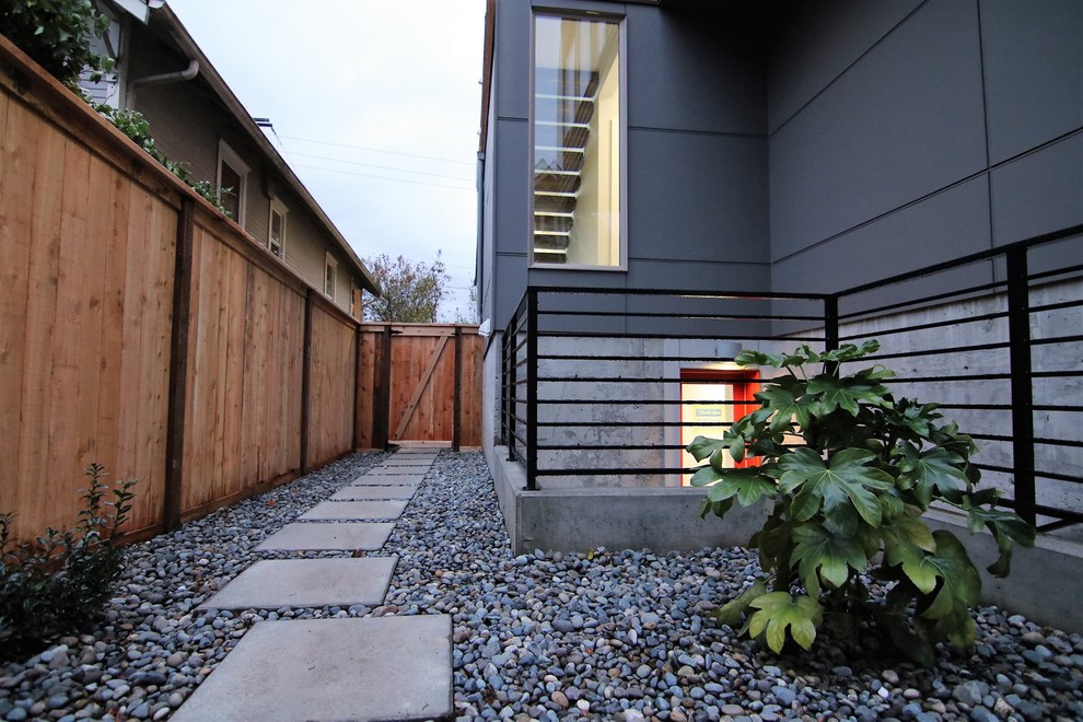 Inspiration for a mid-sized contemporary drought-tolerant and partial sun side yard gravel garden path in Orange County for summer.