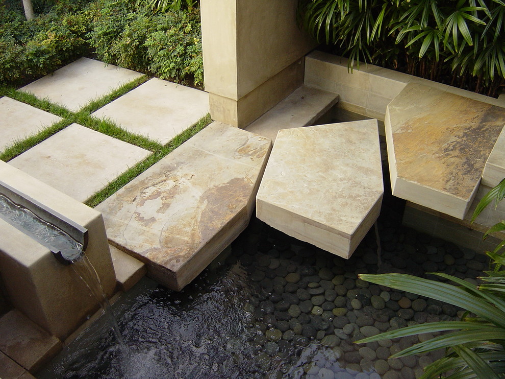Medium sized contemporary back partial sun garden for summer in Orange County with concrete paving.