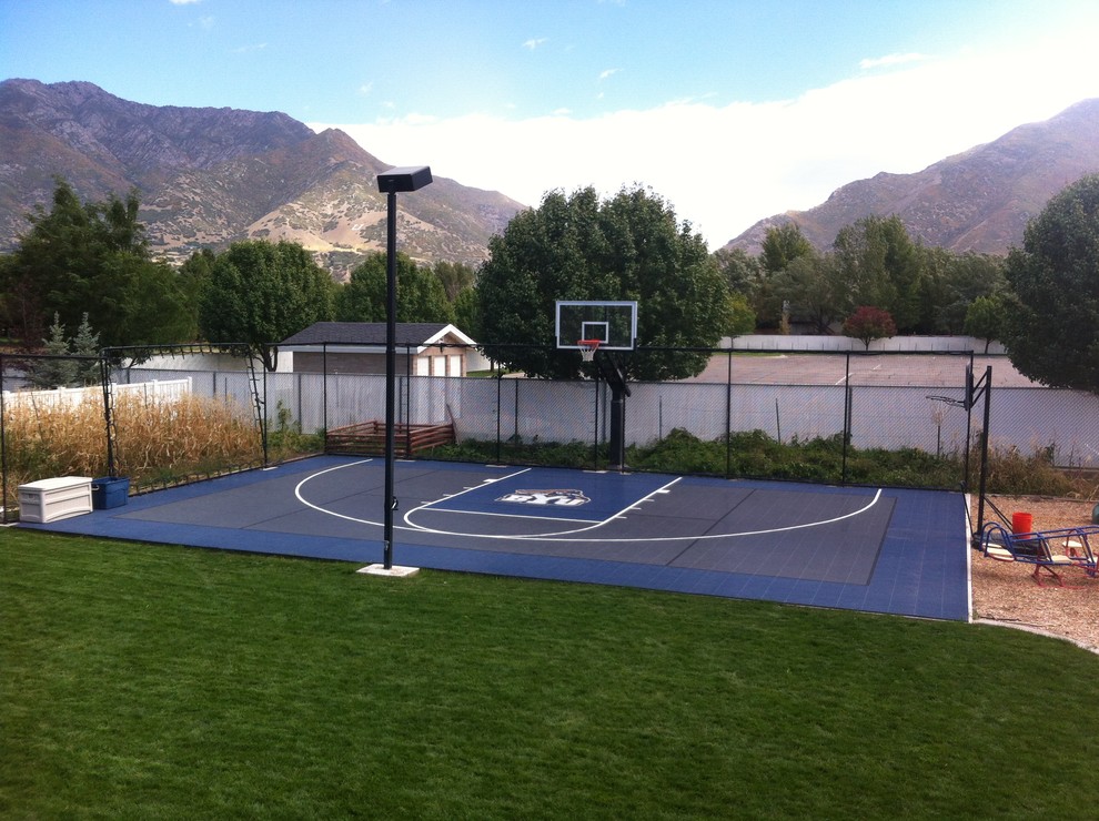 This is an example of a large traditional partial sun backyard outdoor sport court in Salt Lake City.