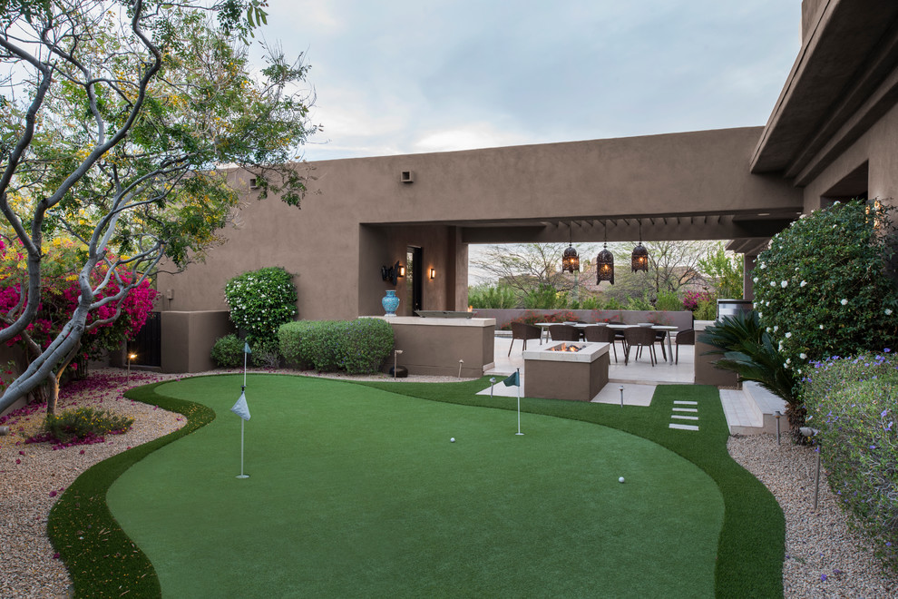 Design ideas for a southwestern full sun backyard gravel outdoor sport court in Phoenix.