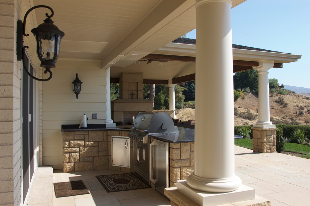 This is an example of a mid-sized transitional full sun backyard stone landscaping in Boise for spring.