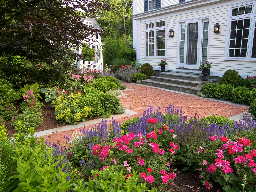 Design ideas for a mid-sized traditional full sun courtyard brick formal garden in Boston.