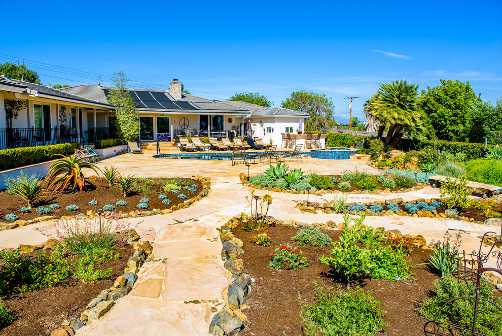 This is an example of a huge mediterranean drought-tolerant and full sun backyard stone garden path in San Diego for summer.