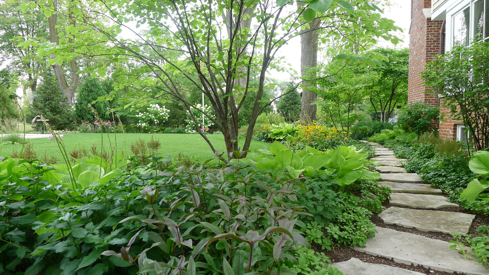 Design ideas for a large rural back fully shaded garden for summer in Chicago with a garden path and natural stone paving.
