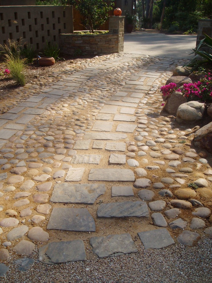 This is an example of a traditional partial sun courtyard stone driveway in San Diego.