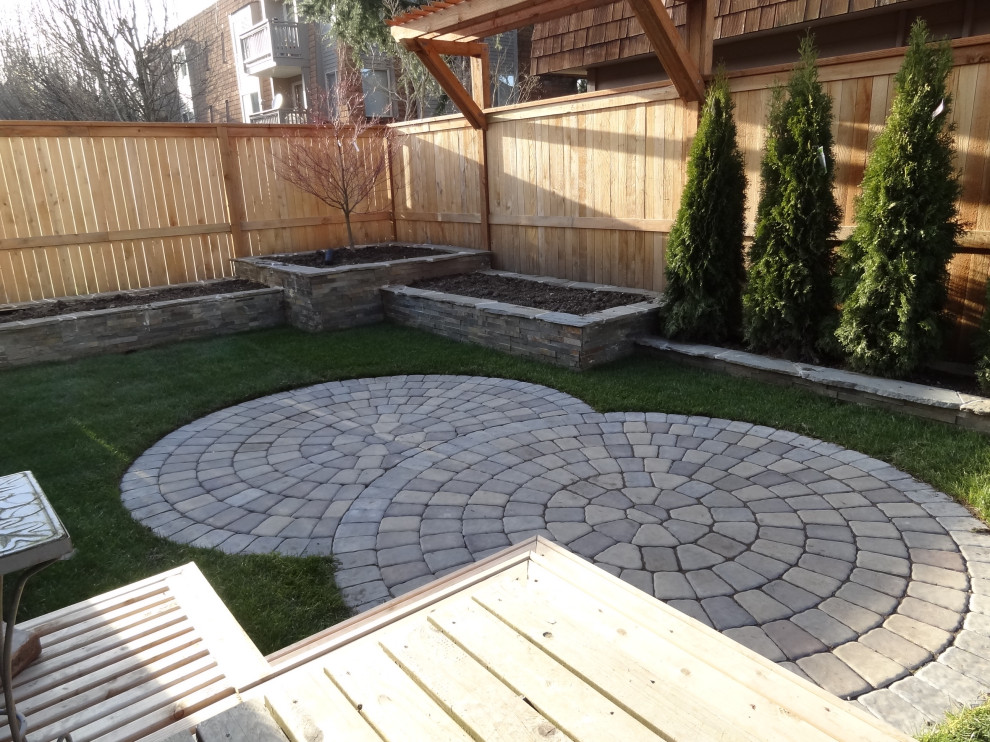 Photo of a small contemporary partial sun backyard stone landscaping in Seattle for spring.