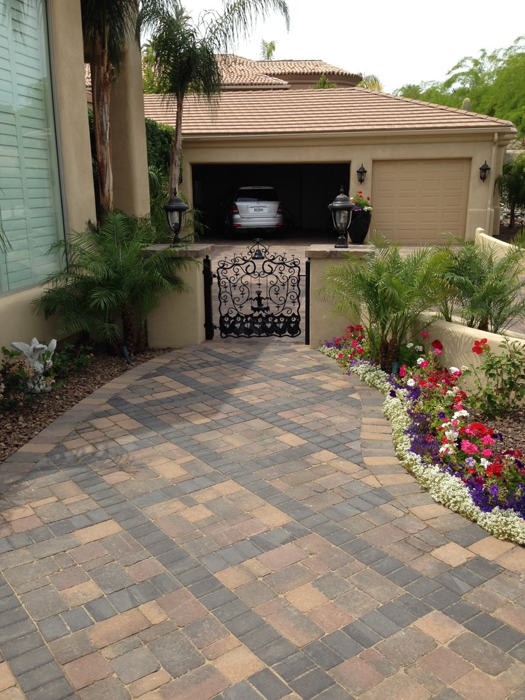 Inspiration for a small mediterranean full sun front yard concrete paver landscaping in Phoenix for spring.