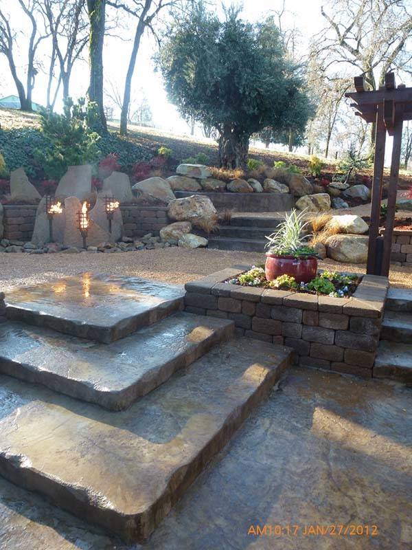 Photo of a mid-sized traditional partial sun backyard brick driveway in Sacramento for summer.