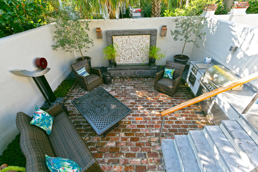 Design ideas for a small traditional partial sun backyard brick landscaping in Charleston.