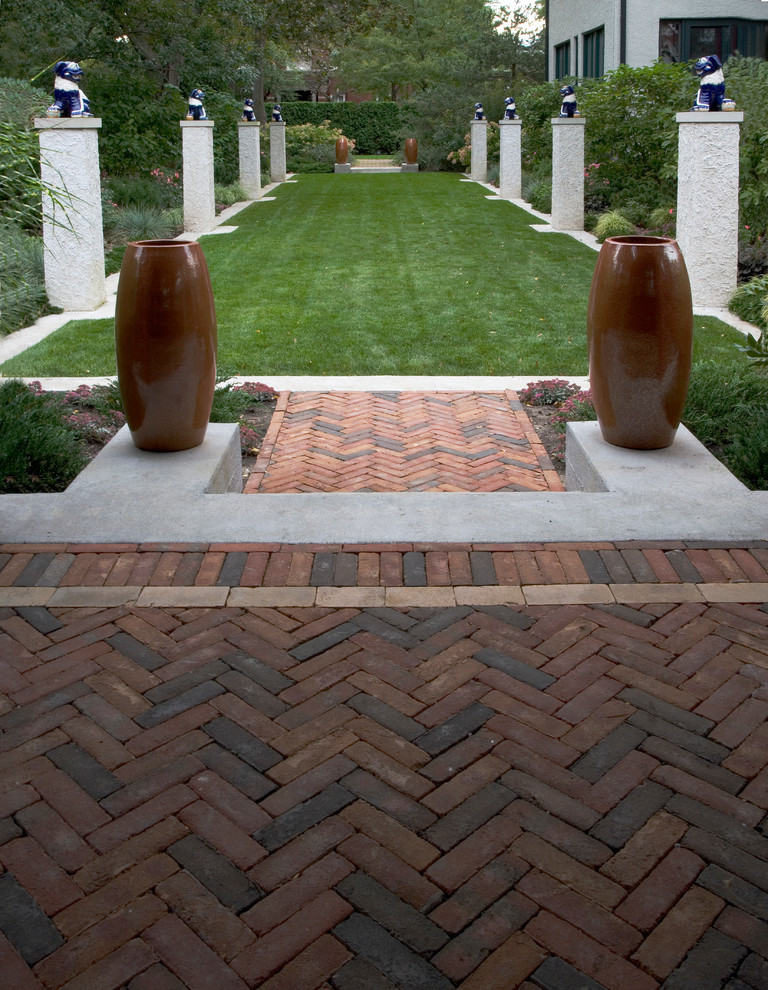 Photo of a large traditional side yard brick formal garden in Chicago.