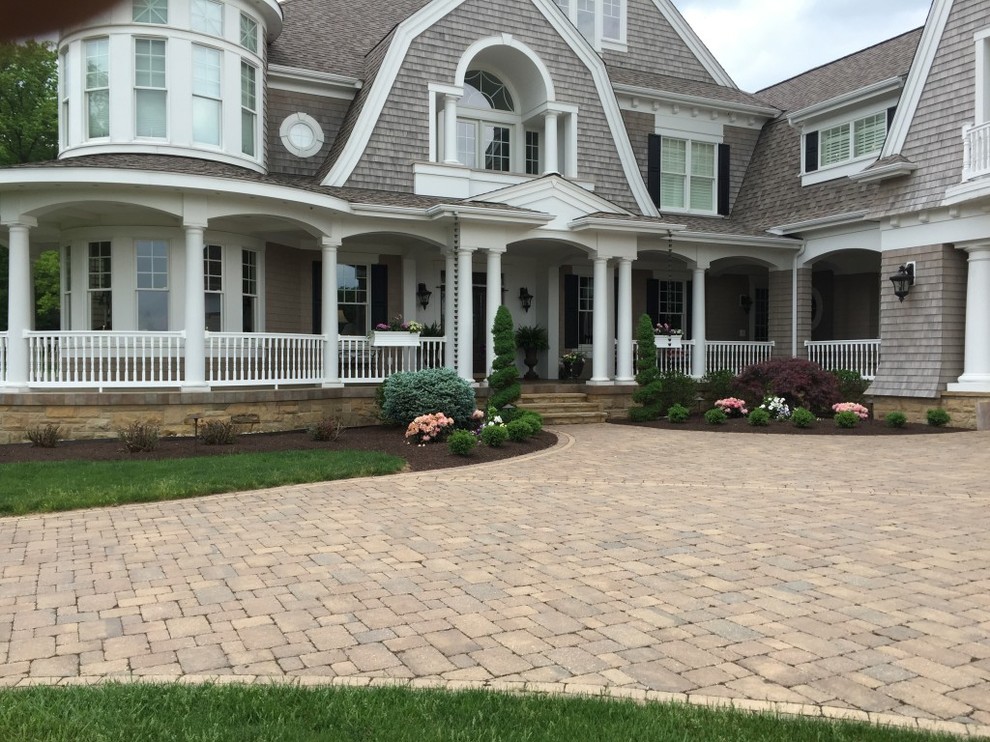 Inspiration for a large traditional front yard driveway in Other.