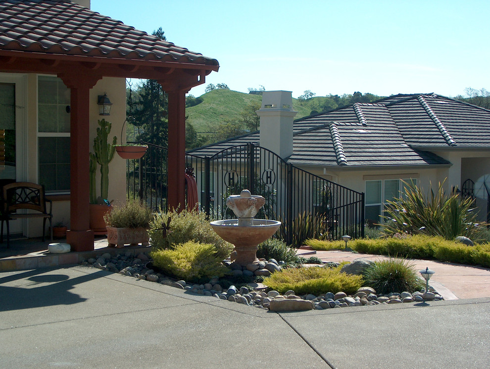 Inspiration for a large mediterranean full sun and drought-tolerant front yard gravel landscaping in San Francisco.