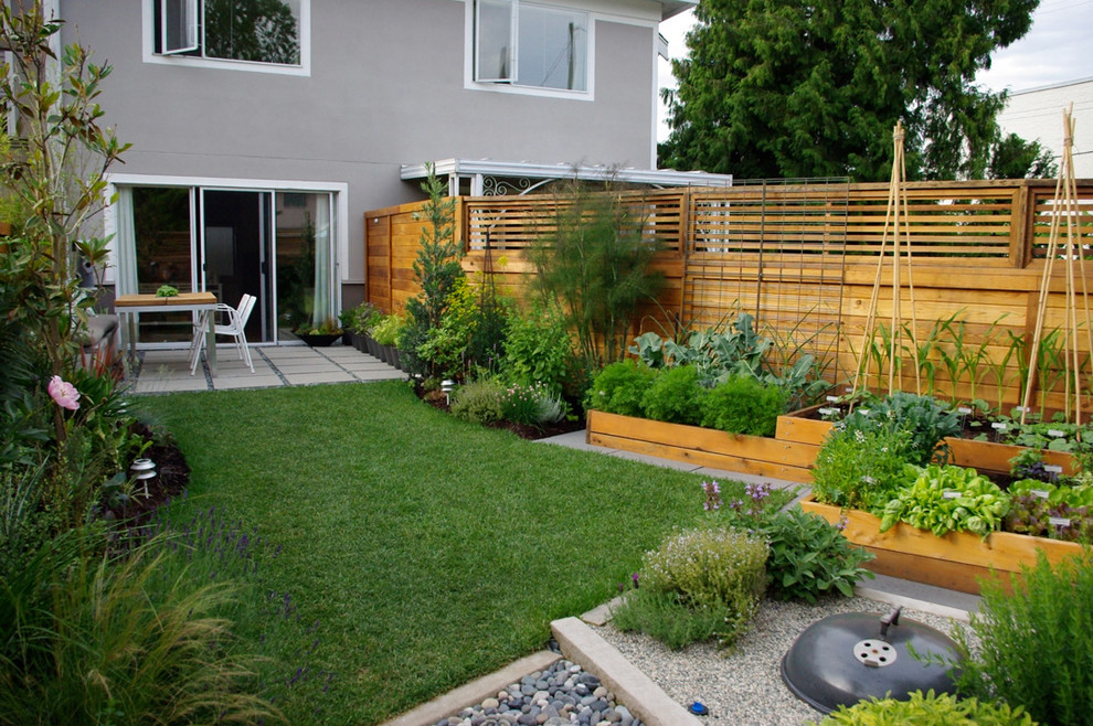 Photo of a contemporary backyard vegetable garden landscape in Vancouver.