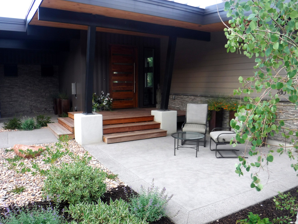 Design ideas for a medium sized contemporary courtyard xeriscape full sun garden for summer in Salt Lake City with a garden path and concrete paving.