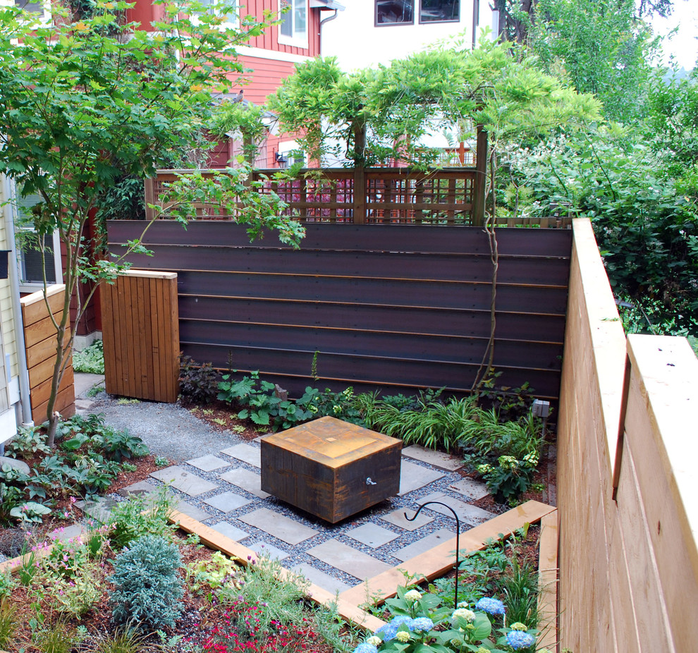 Inspiration for a small modern partial sun courtyard stone vegetable garden landscape in Seattle.