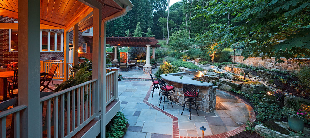 Inspiration for an expansive rustic back driveway full sun garden in DC Metro with concrete paving.