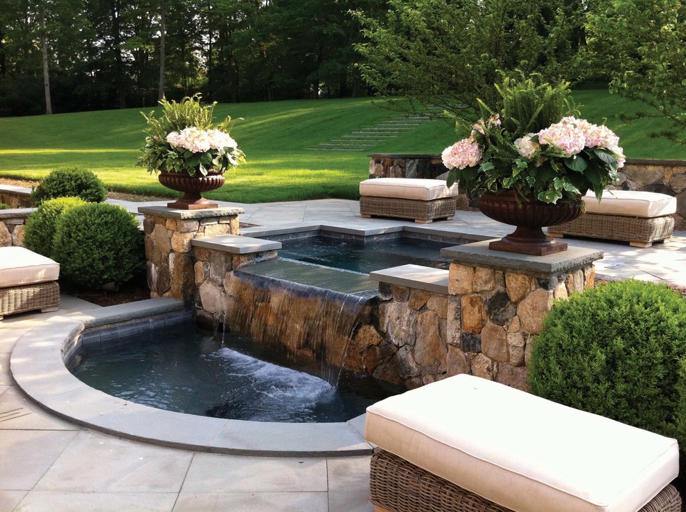 Photo of a traditional garden in New York with a water feature.