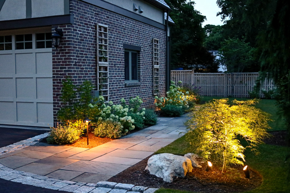 Design ideas for a mid-sized french country partial sun side yard garden path in Boston.