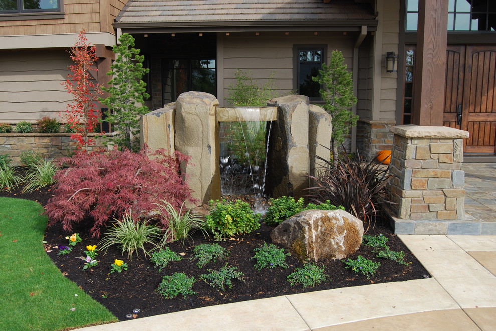 This is an example of a transitional water fountain landscape in Portland.