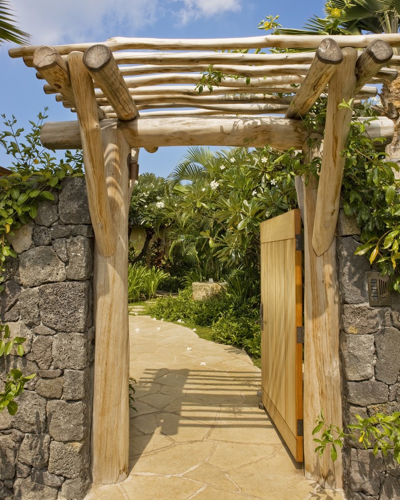 Design ideas for a world-inspired garden in Hawaii with natural stone paving.