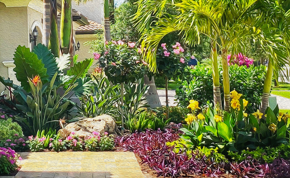 Ispirazione per un giardino formale tropicale di medie dimensioni e davanti casa con pavimentazioni in pietra naturale