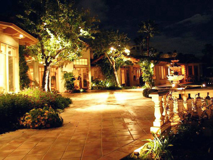 Photo of a large traditional front driveway garden in San Diego.