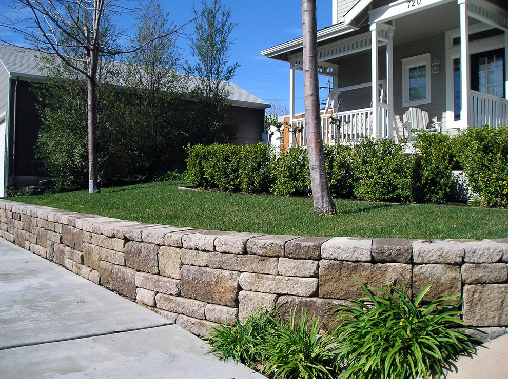 This is an example of a mid-sized craftsman front yard stone retaining wall landscape in San Luis Obispo.
