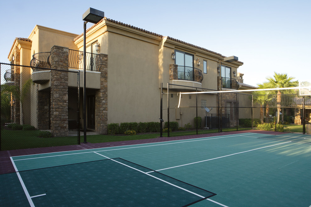 Photo of a large mediterranean side garden in Phoenix with an outdoor sport court and decking.