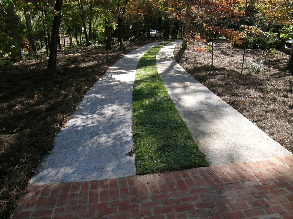 Exposed Aggregate Driveway Strips stained with Gray color and washed