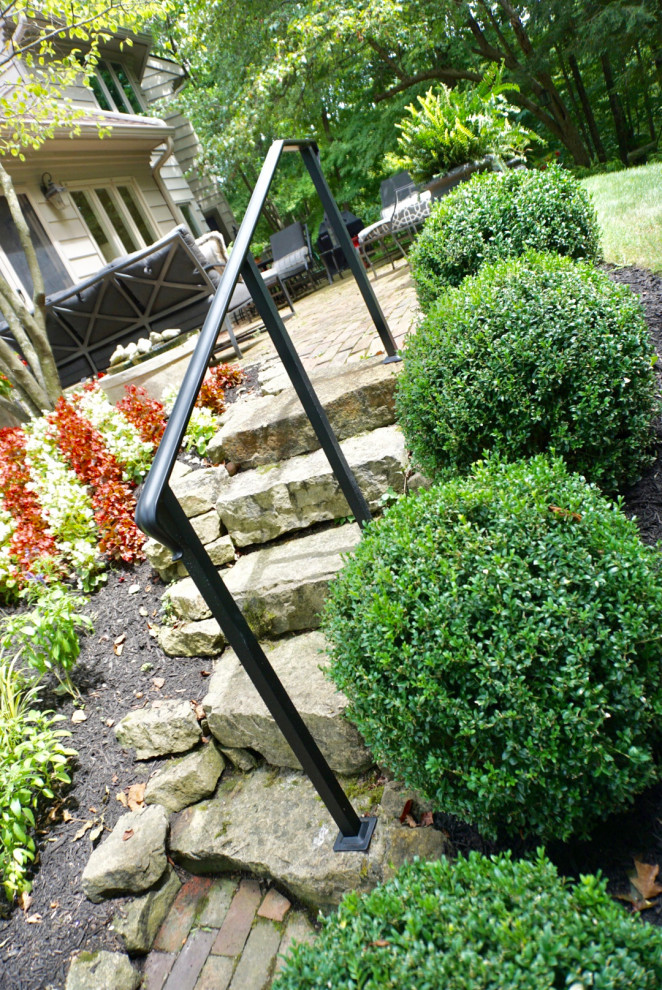 Design ideas for a large farmhouse partial sun side yard stone landscaping in Columbus for summer.