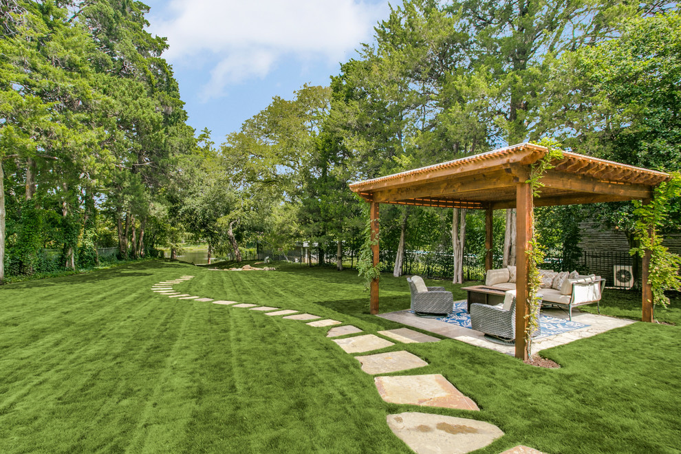This is an example of a mediterranean back pergola in Dallas.