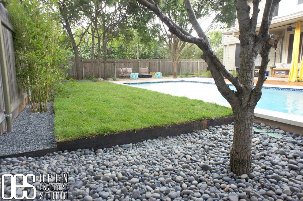 Design ideas for a large modern back xeriscape partial sun garden in Austin with decking.