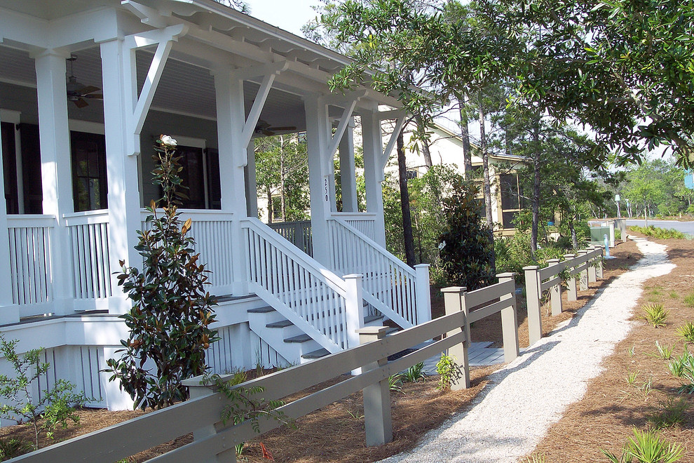 Design ideas for a small coastal partial sun front yard concrete paver garden path in Miami.