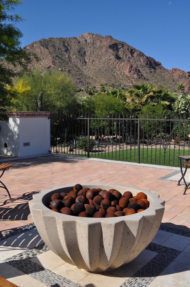 Photo of a mediterranean landscaping in Phoenix with a fire pit.