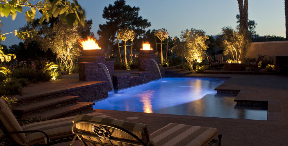 Design ideas for a large contemporary full sun backyard concrete paver water fountain landscape in Las Vegas.
