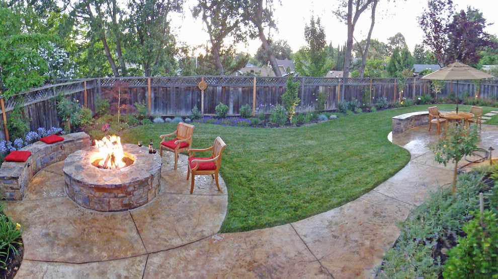 Medium sized rustic back partial sun garden in San Francisco with a fire feature and concrete paving.