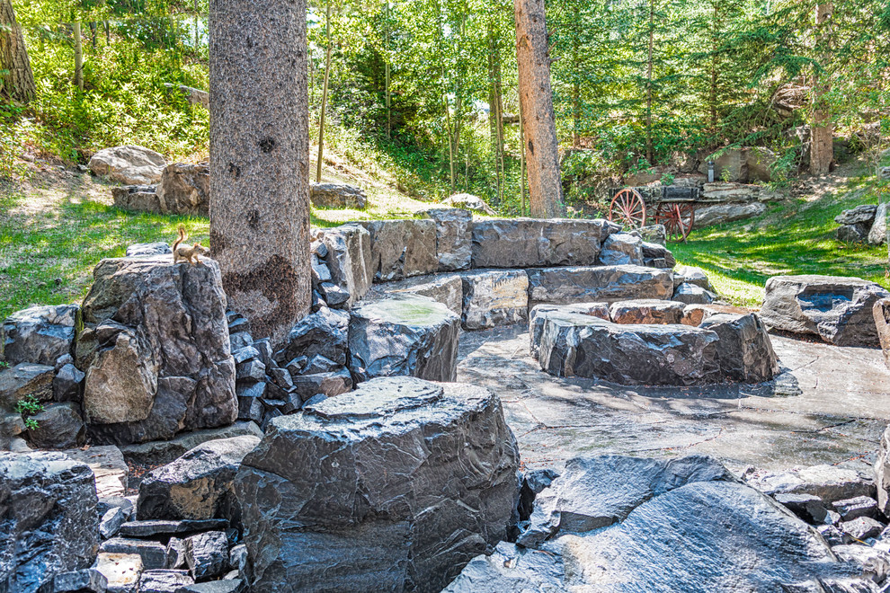 Flagstone Patio with Fire Pit & Stone Seating Retaining Wall