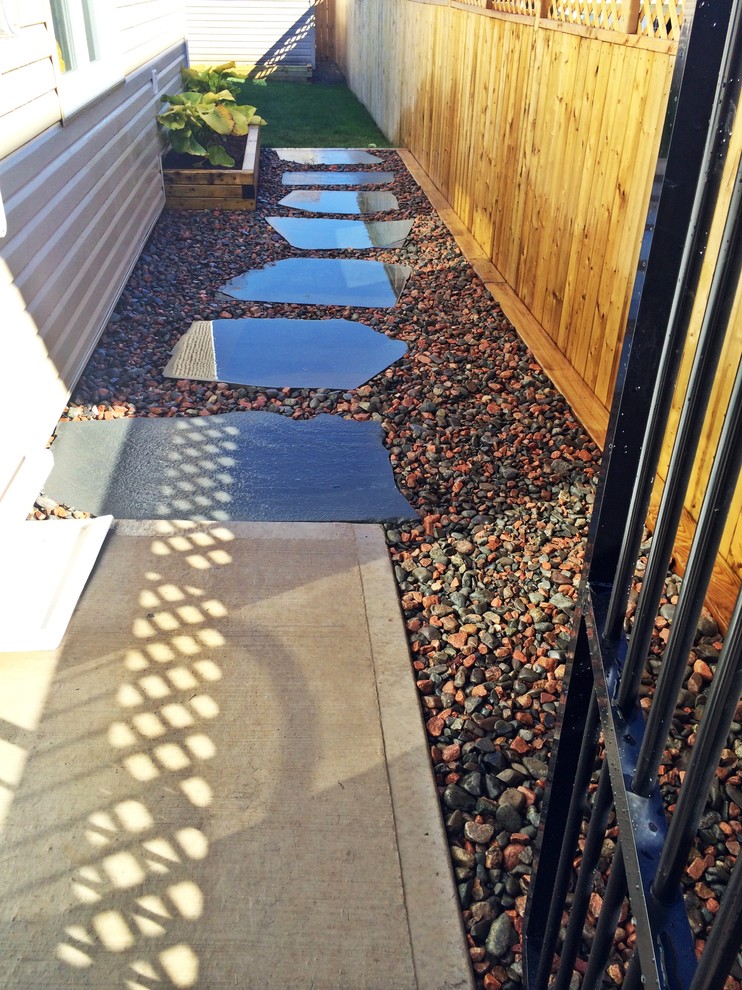 Inspiration for a small modern drought-tolerant side yard garden path in Other.
