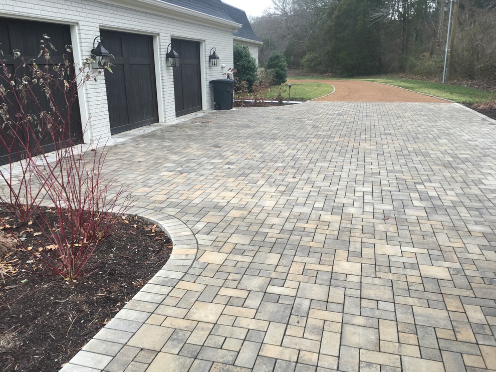 Inspiration for a large classic front driveway full sun garden in Nashville with concrete paving.