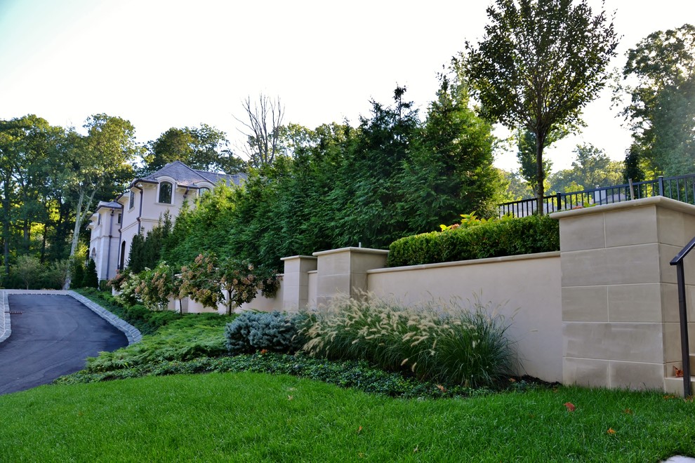 Design ideas for a huge traditional partial sun front yard landscaping in New York.