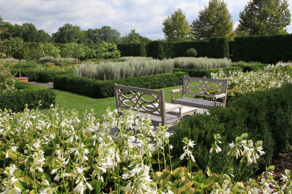 Photo of an expansive classic back formal full sun garden seating in New York.