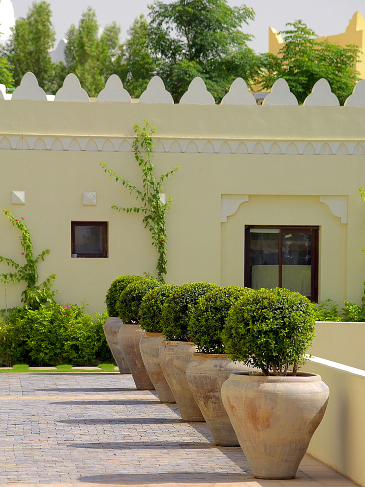 Design ideas for a mediterranean brick landscaping in Other.