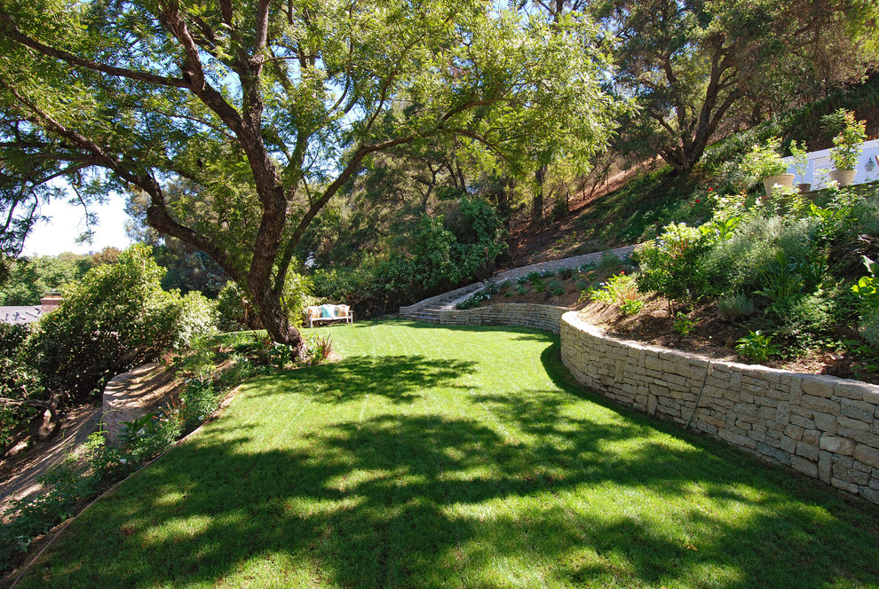Photo of a french country backyard landscaping in Los Angeles.