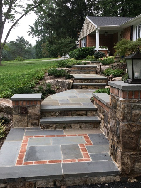 Inspiration for a medium sized classic front formal partial sun garden for summer in Baltimore with a garden path and natural stone paving.