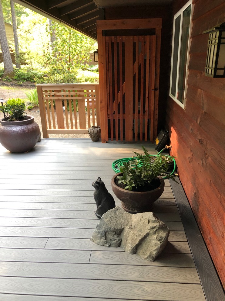 This is an example of a mid-sized contemporary partial sun courtyard landscaping in Seattle with decking for summer.
