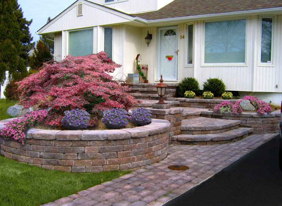 Inspiration for a front yard concrete paver landscaping in New York.