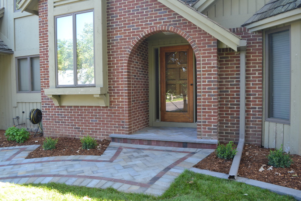 Photo of a large contemporary stone landscaping in Minneapolis.